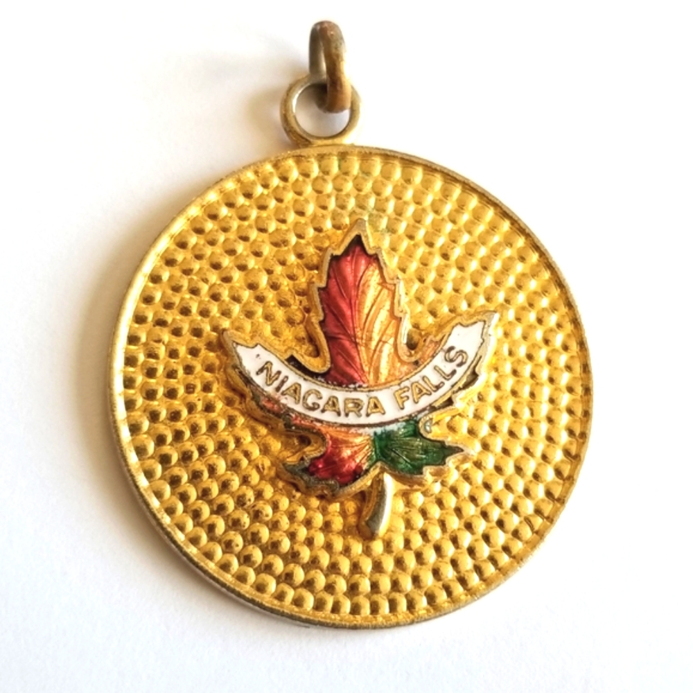 Vintage Niagara Falls pendant charm gold tone Canada maple leaf enamel